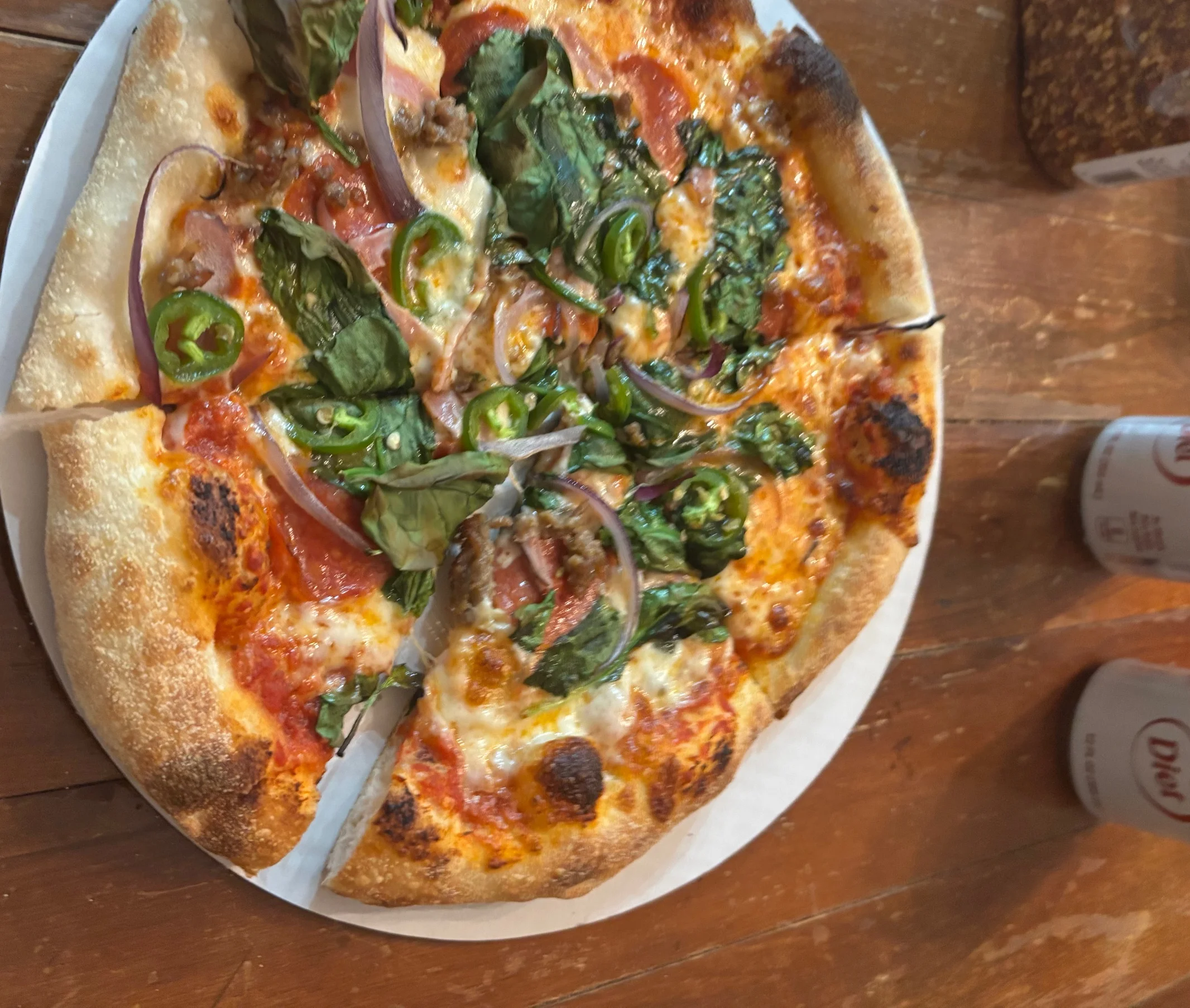 Delicious pepperoni pizza topped with fresh greens