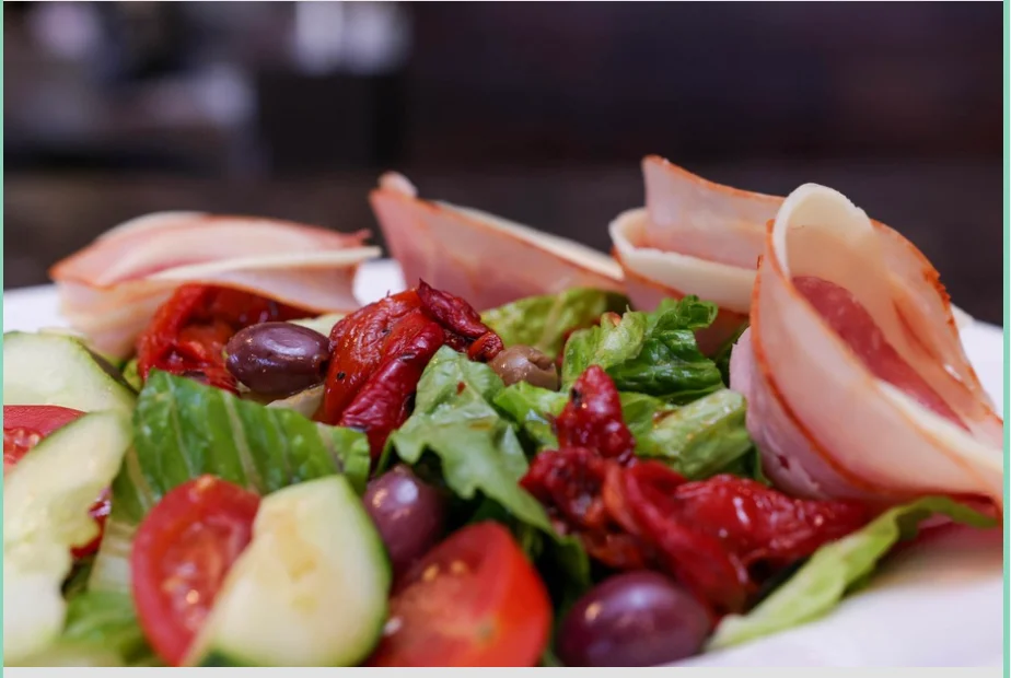 Italian antipasto salad with cured meats and vegetables