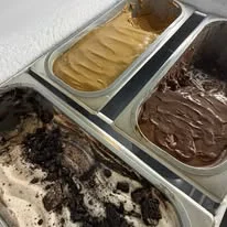 Assorted gelato flavors in a display case