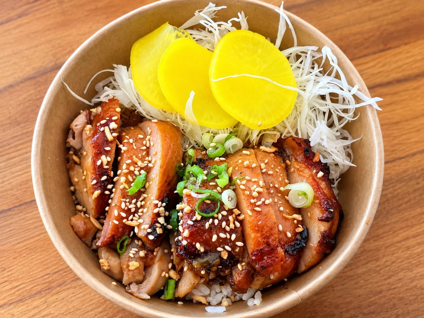 Korean grilled chicken rice bowl with pickled vegetables