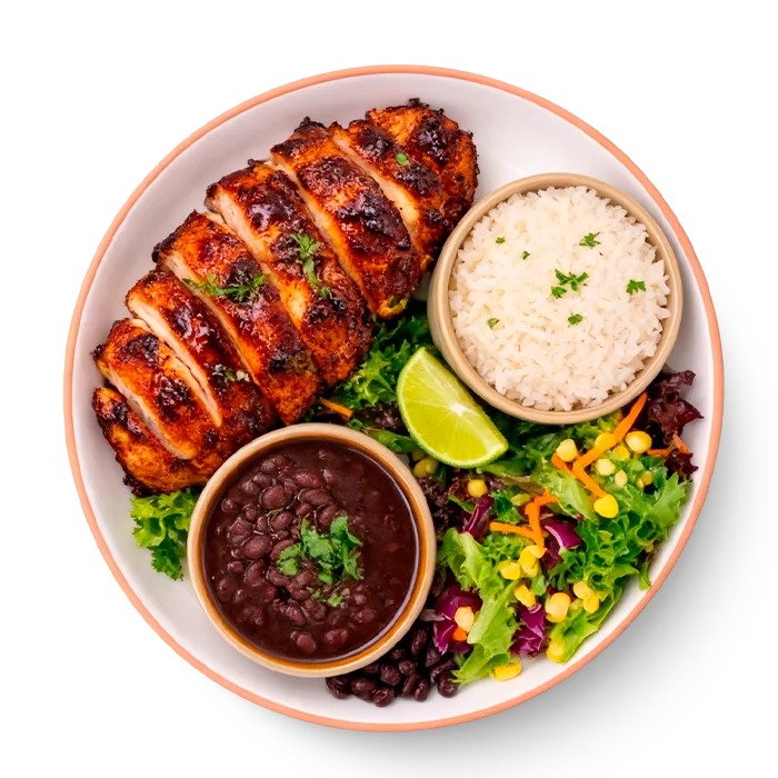 Delicious BBQ chicken served on a plate with vibrant garnishes.