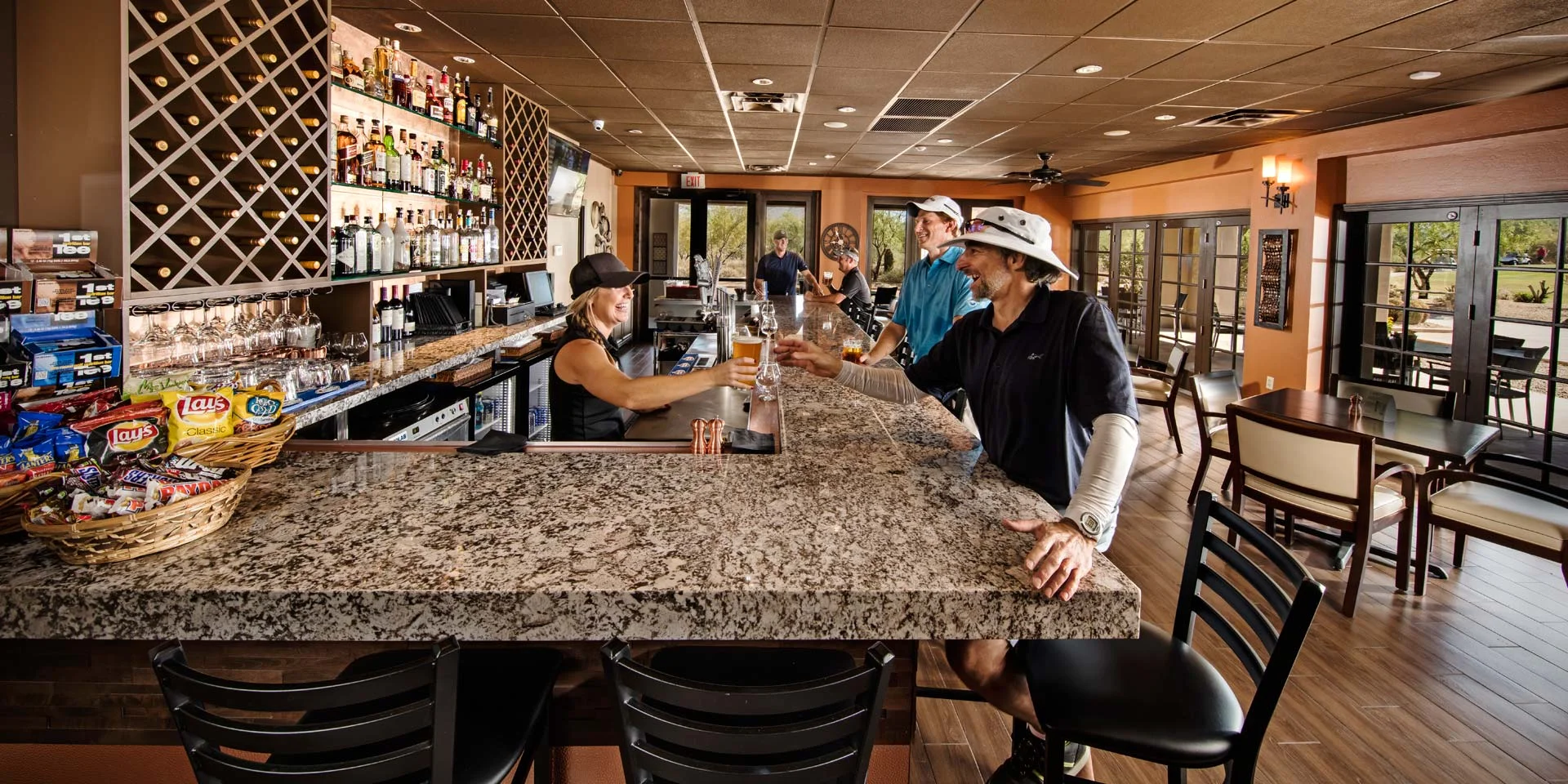 Modern bar interior with patrons enjoying drinks