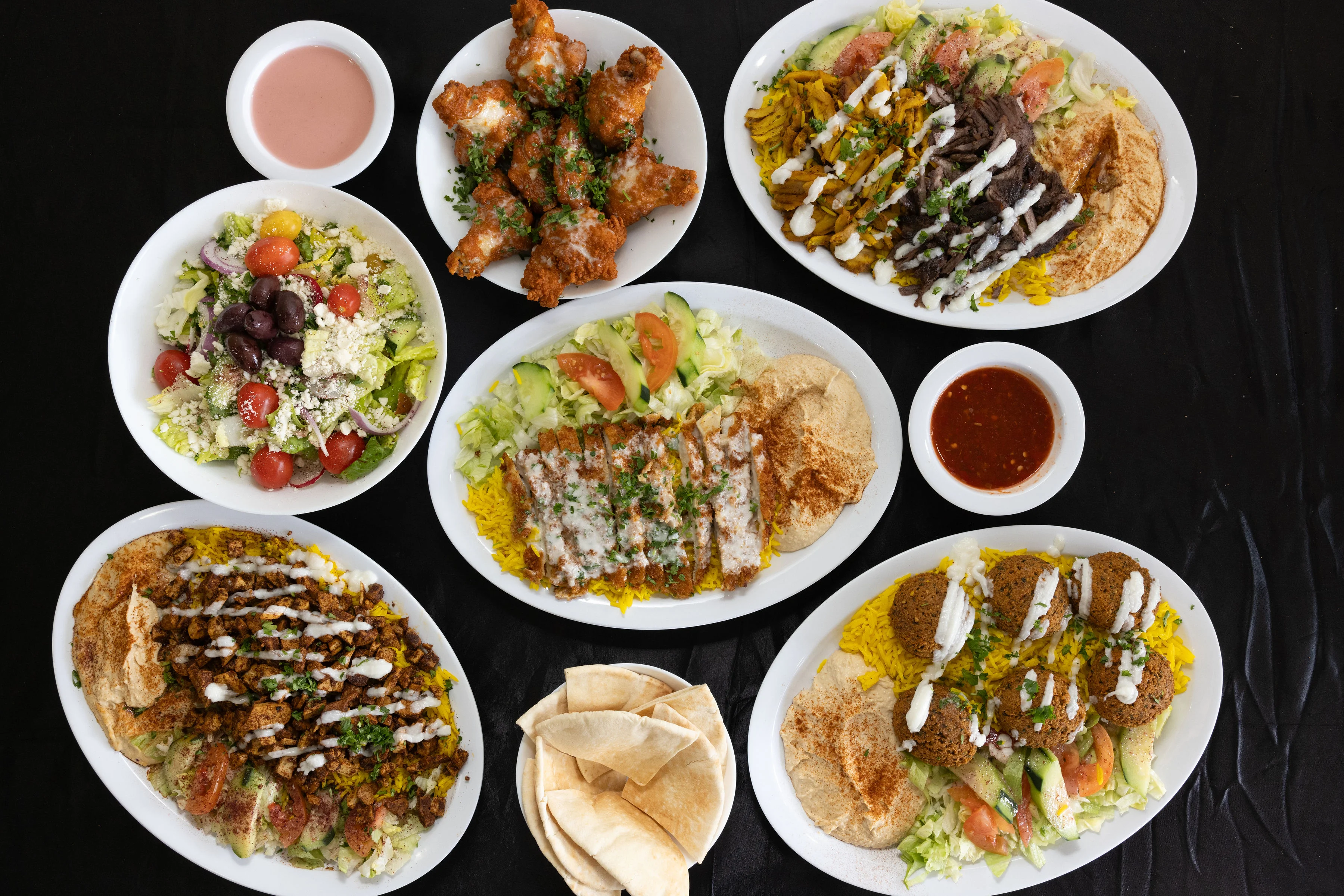 Mediterranean platter with falafel, hummus, and grilled meats
