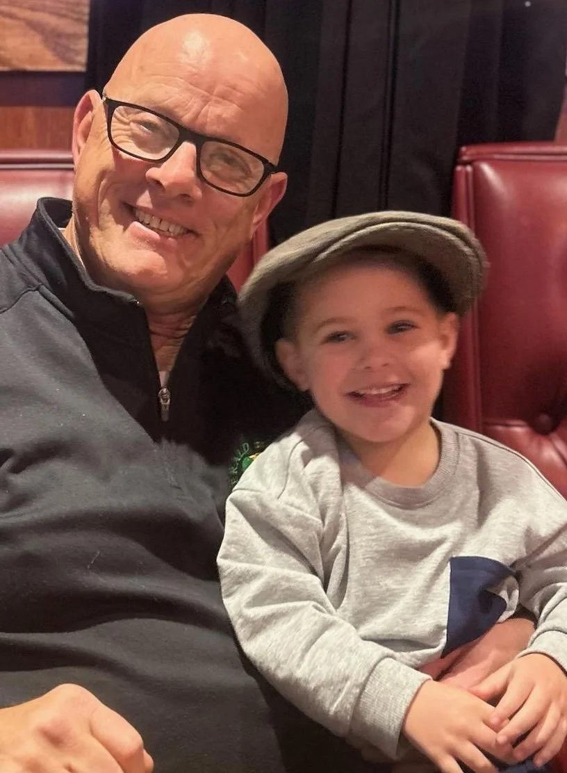 Happy moments shared between a grandfather and grandson in a cozy restaurant setting