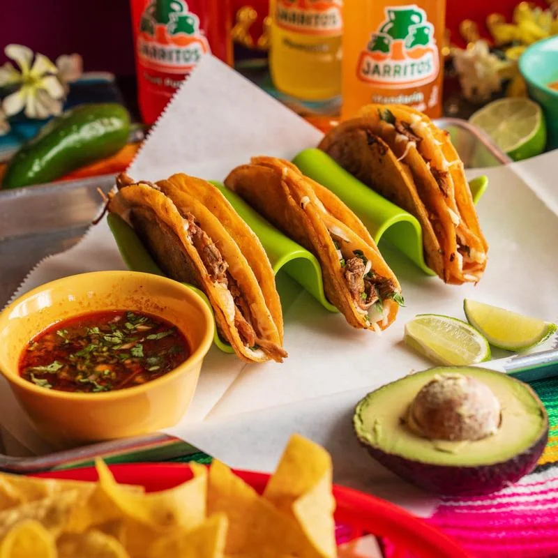 Delicious Mexican street tacos served with salsa and lime