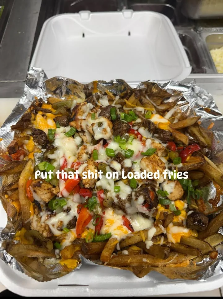 Loaded fries topped with grilled chicken and vegetables