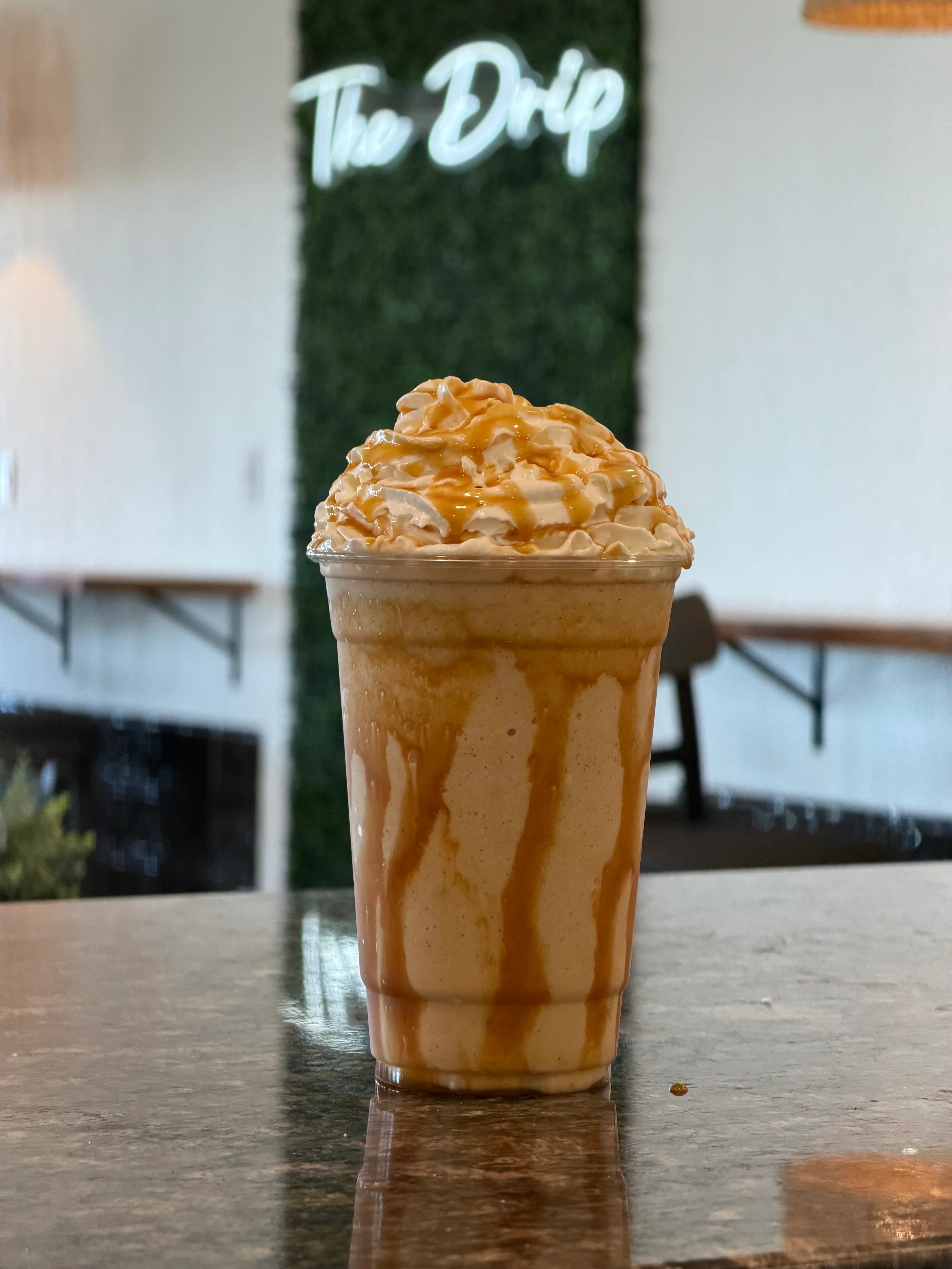 Caramel frappuccino topped with whipped cream