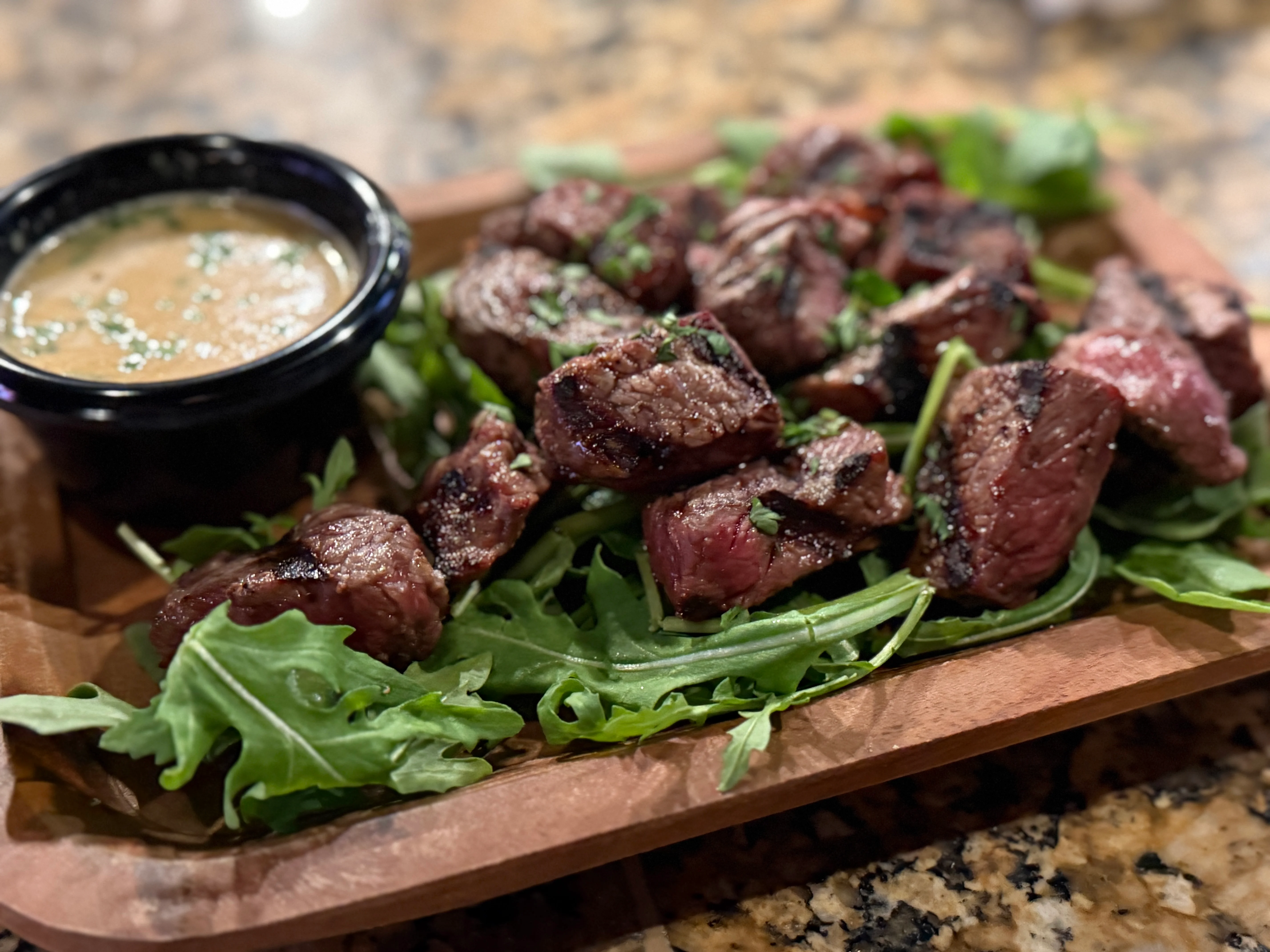 Grilled steak bites with chimichurri sauce