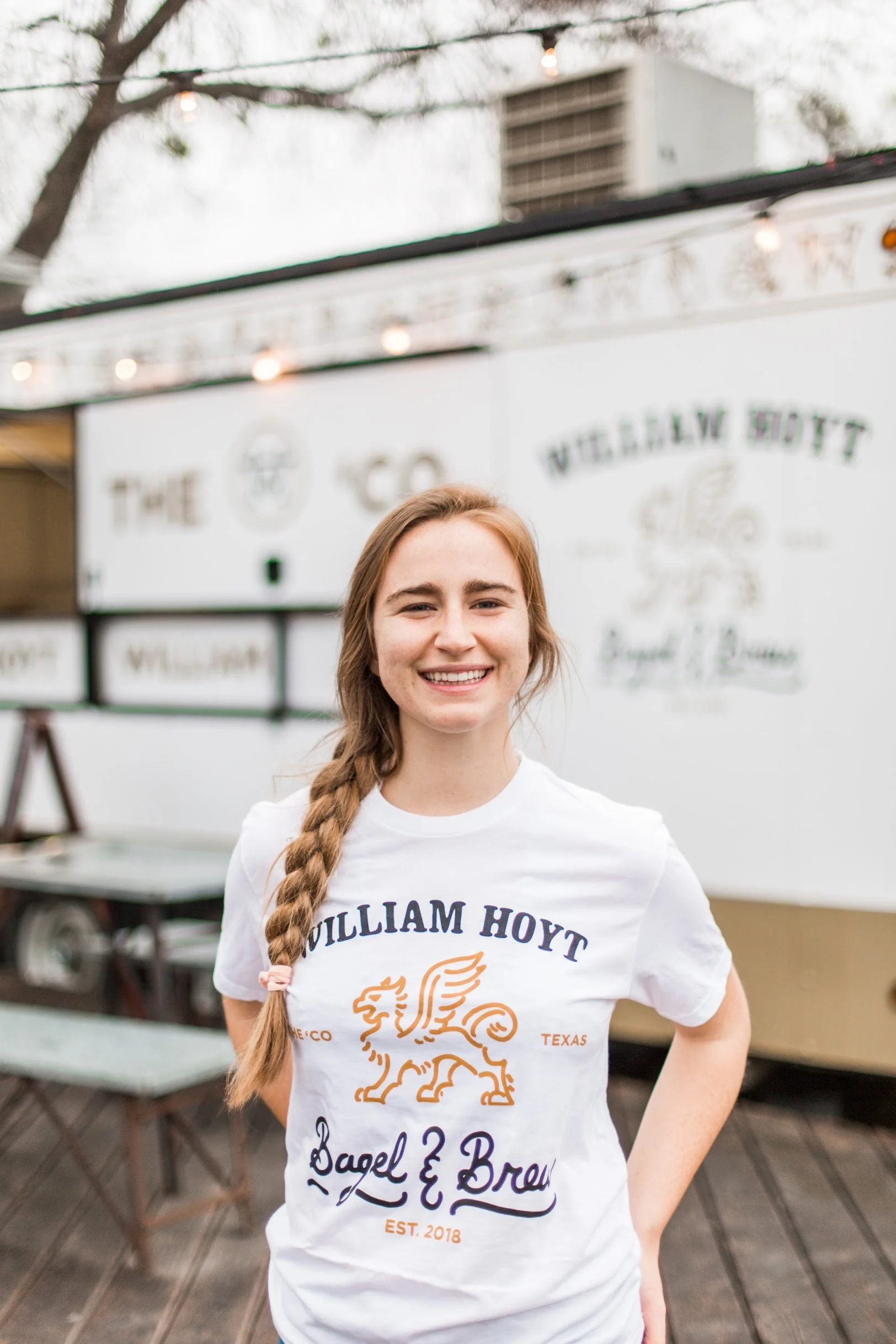 Smiling staff member at William Hoyt Bagel & Brew food truck