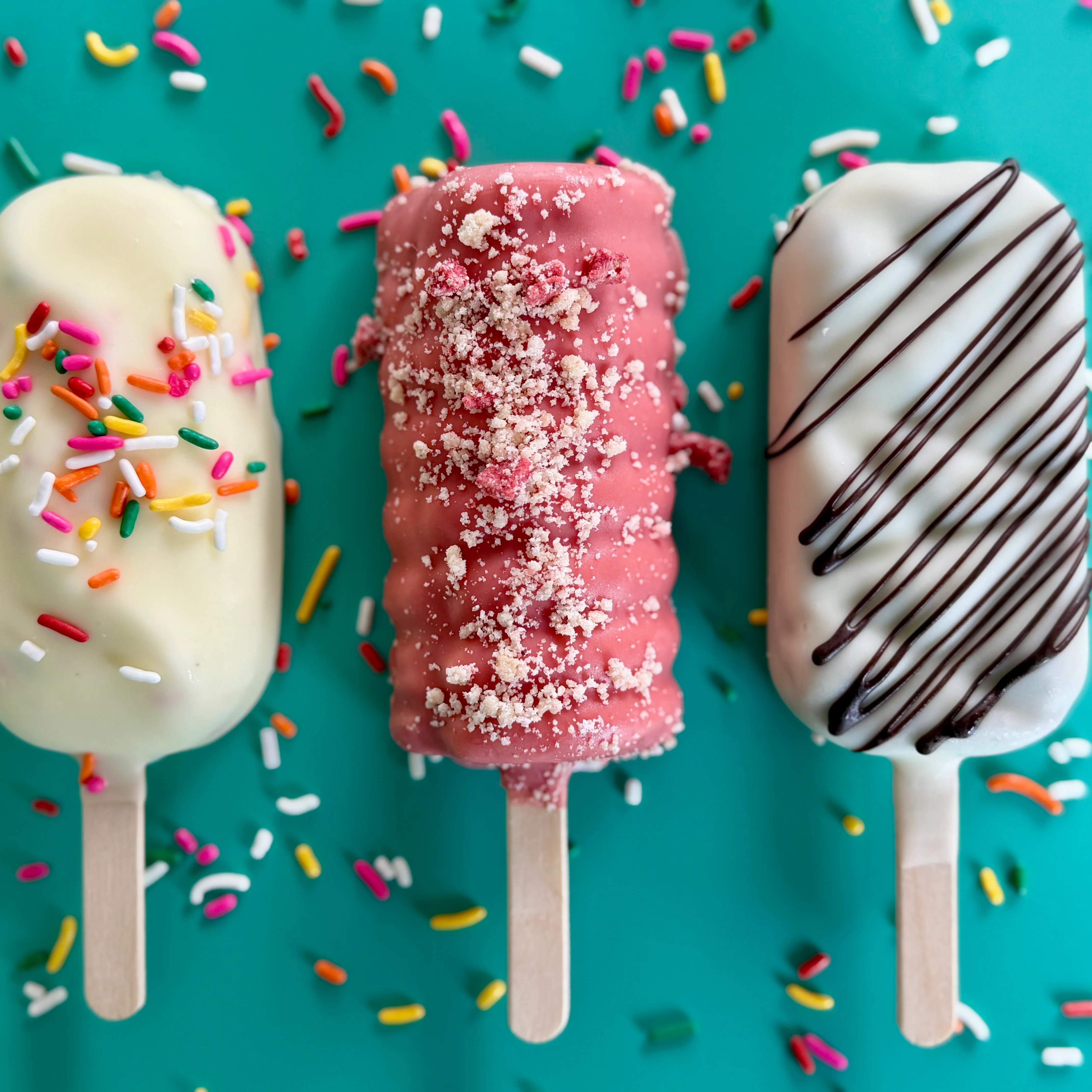 Colorful ice cream popsicles with sprinkles