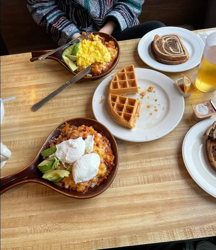 Hearty brunch featuring huevos rancheros and waffles
