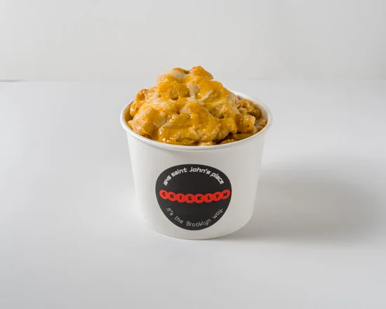 Creamy mac and cheese in a takeout cup