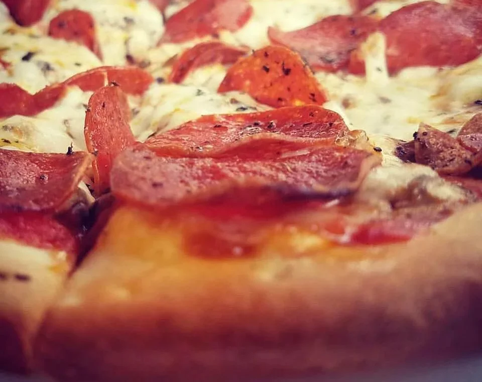 Pepperoni pizza with melted cheese and crispy crust