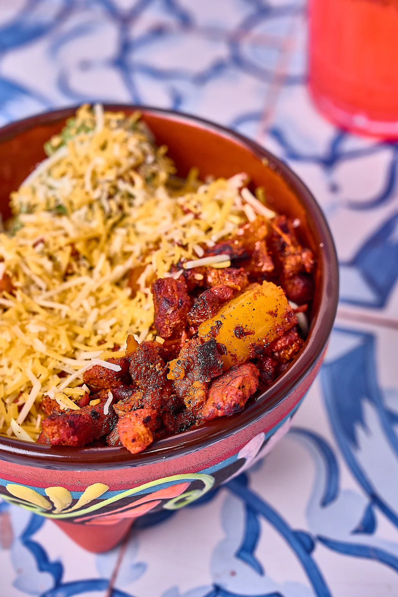 Spicy Mexican chicken tinga bowl with cheese