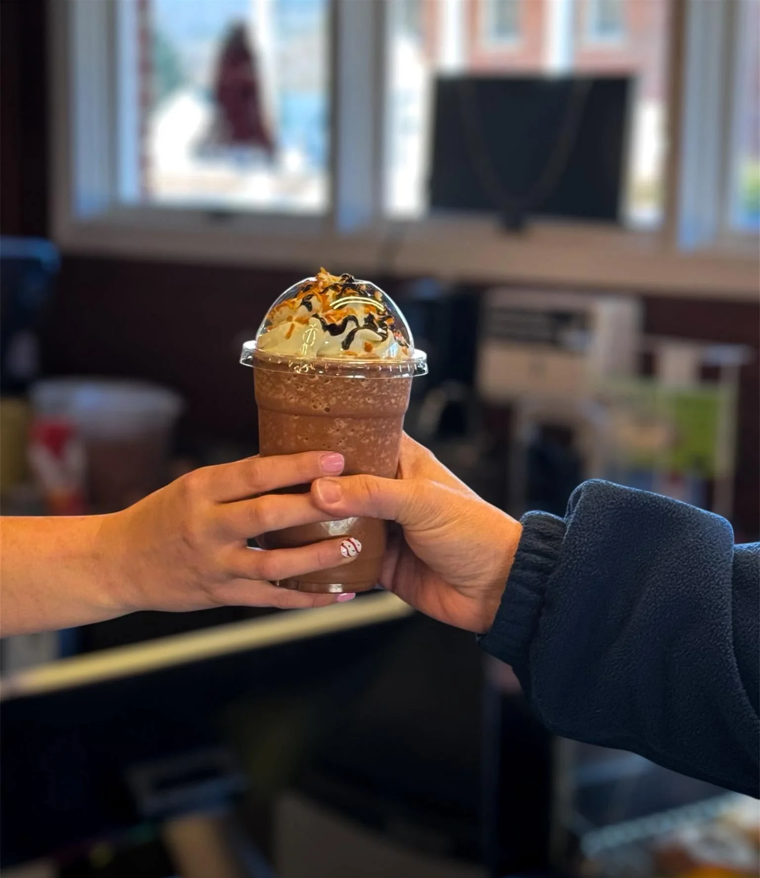 Frosted mocha frappuccino topped with whipped cream