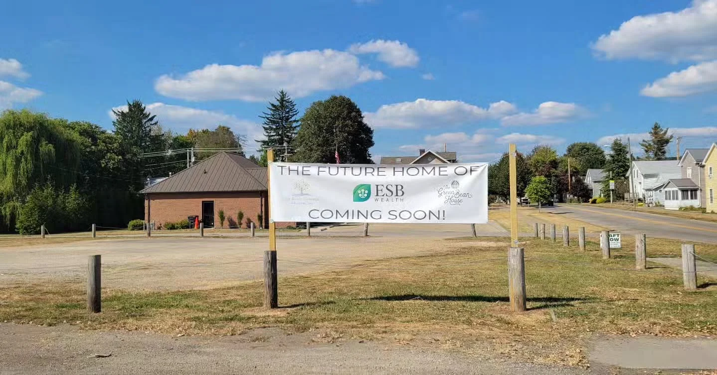Future restaurant location with signage announcing upcoming establishment