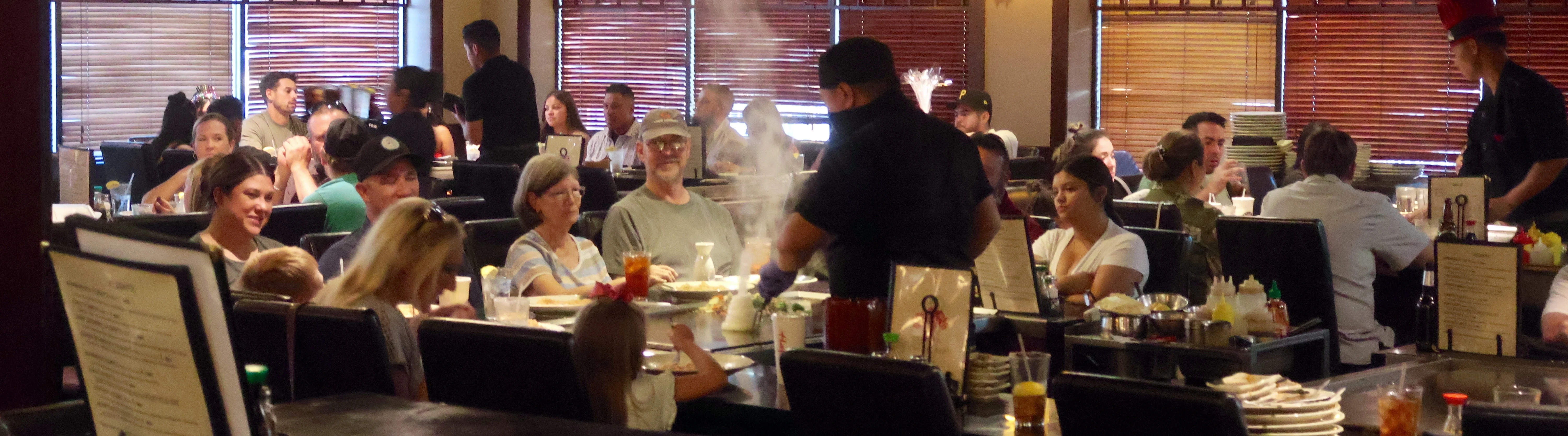 Busy restaurant interior with diners enjoying meals