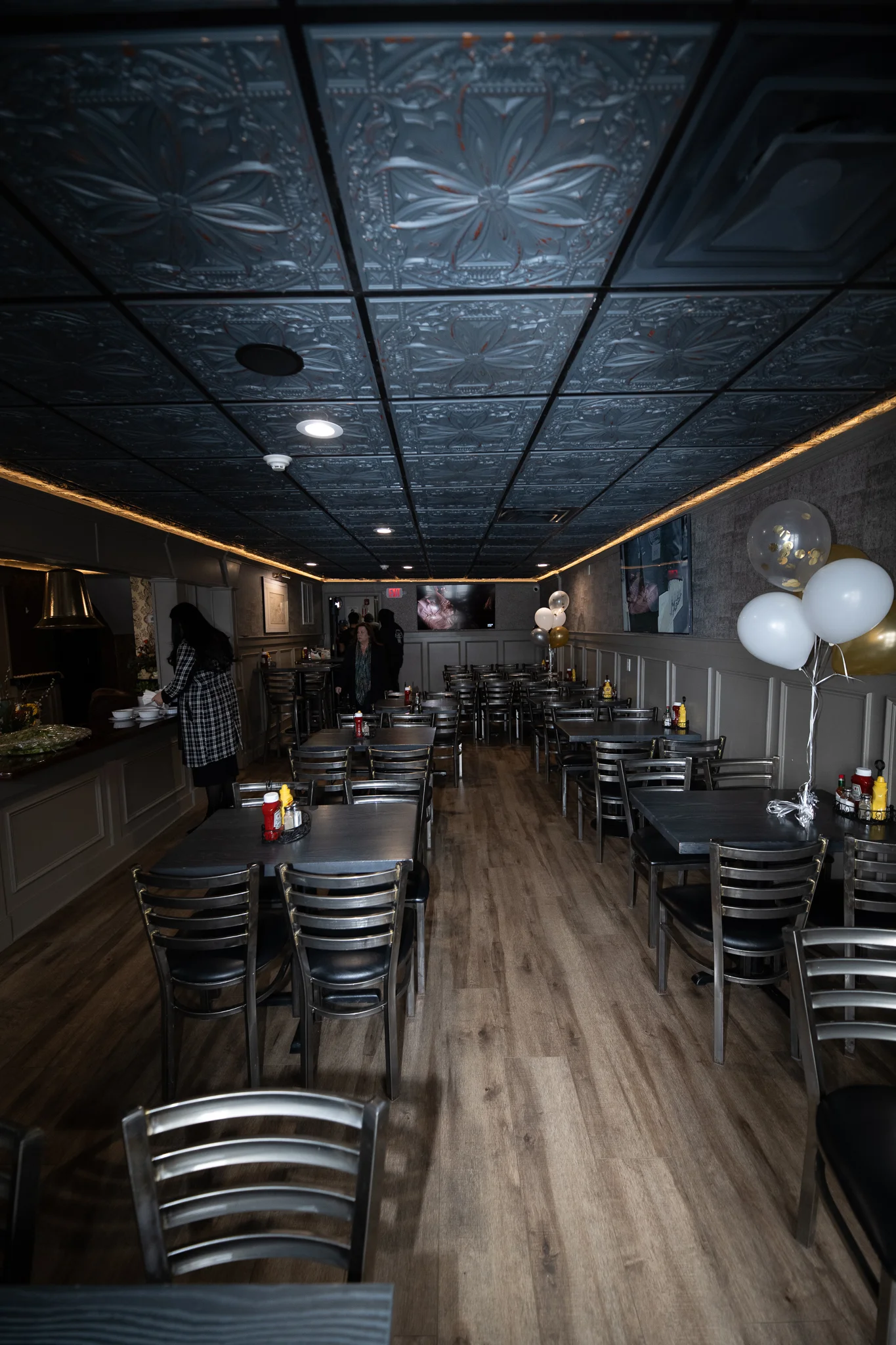 Cozy restaurant interior with elegant decor and wooden flooring