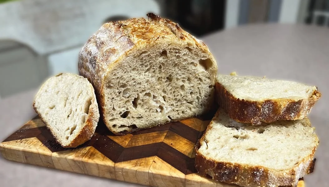 Artisan sourdough bread on a wooden cutting board