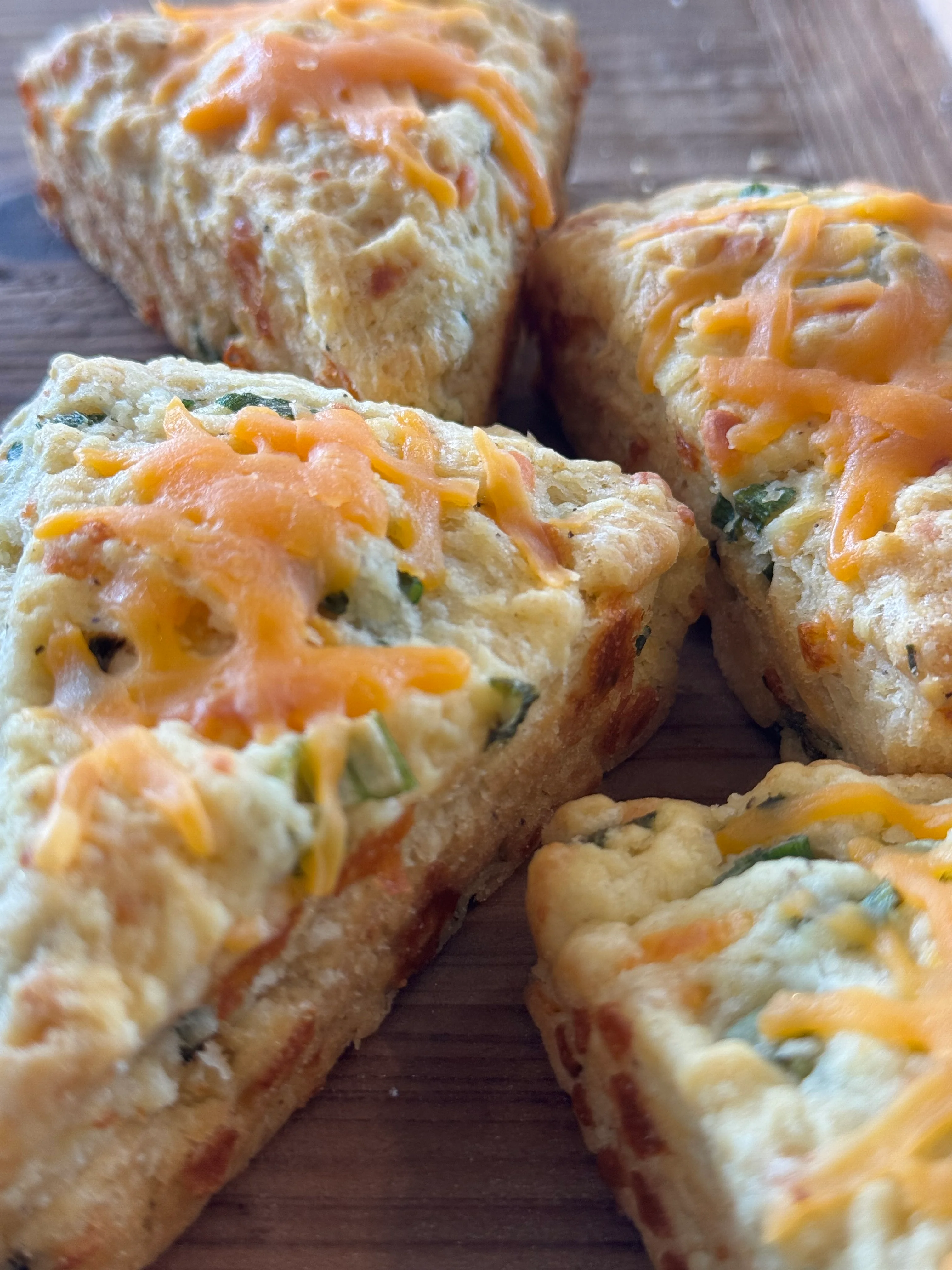 Savory cheddar scones on a wooden board