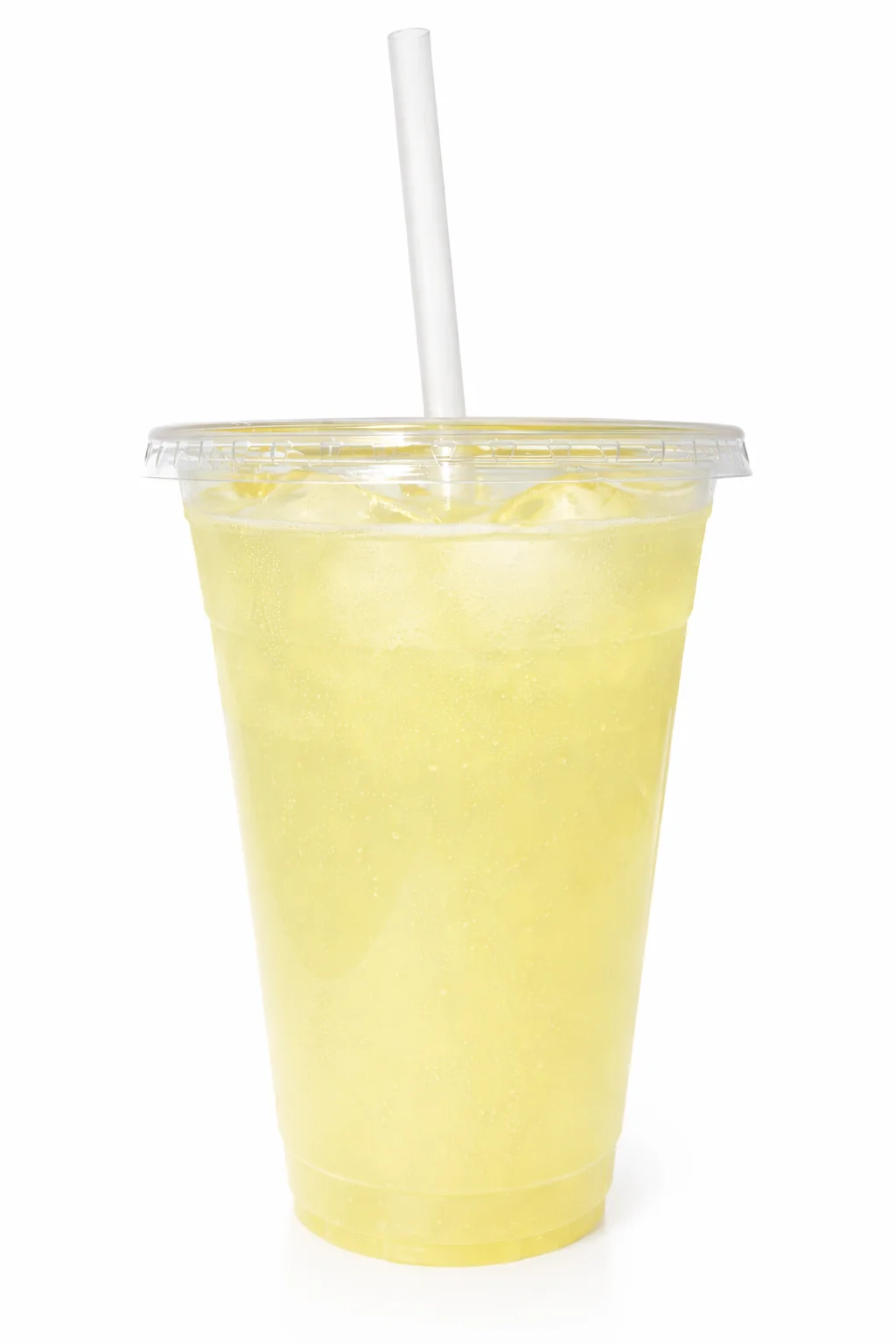A transparent cup filled with a yellow, fizzy drink and ice cubes, topped with a straw.