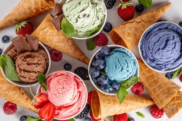 Colorful ice cream scoops in waffle cones