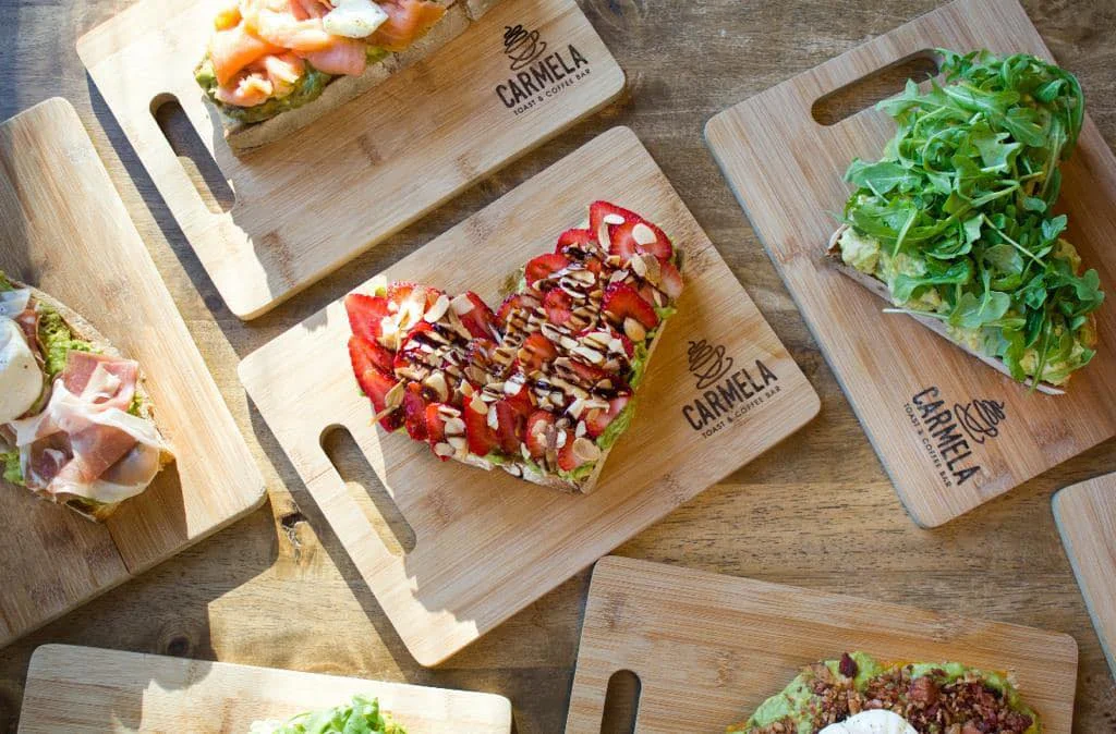 Artisan avocado toast with fresh strawberries and nuts