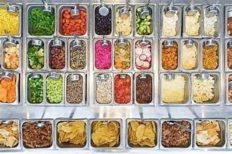 Colorful salad bar with fresh toppings and ingredients