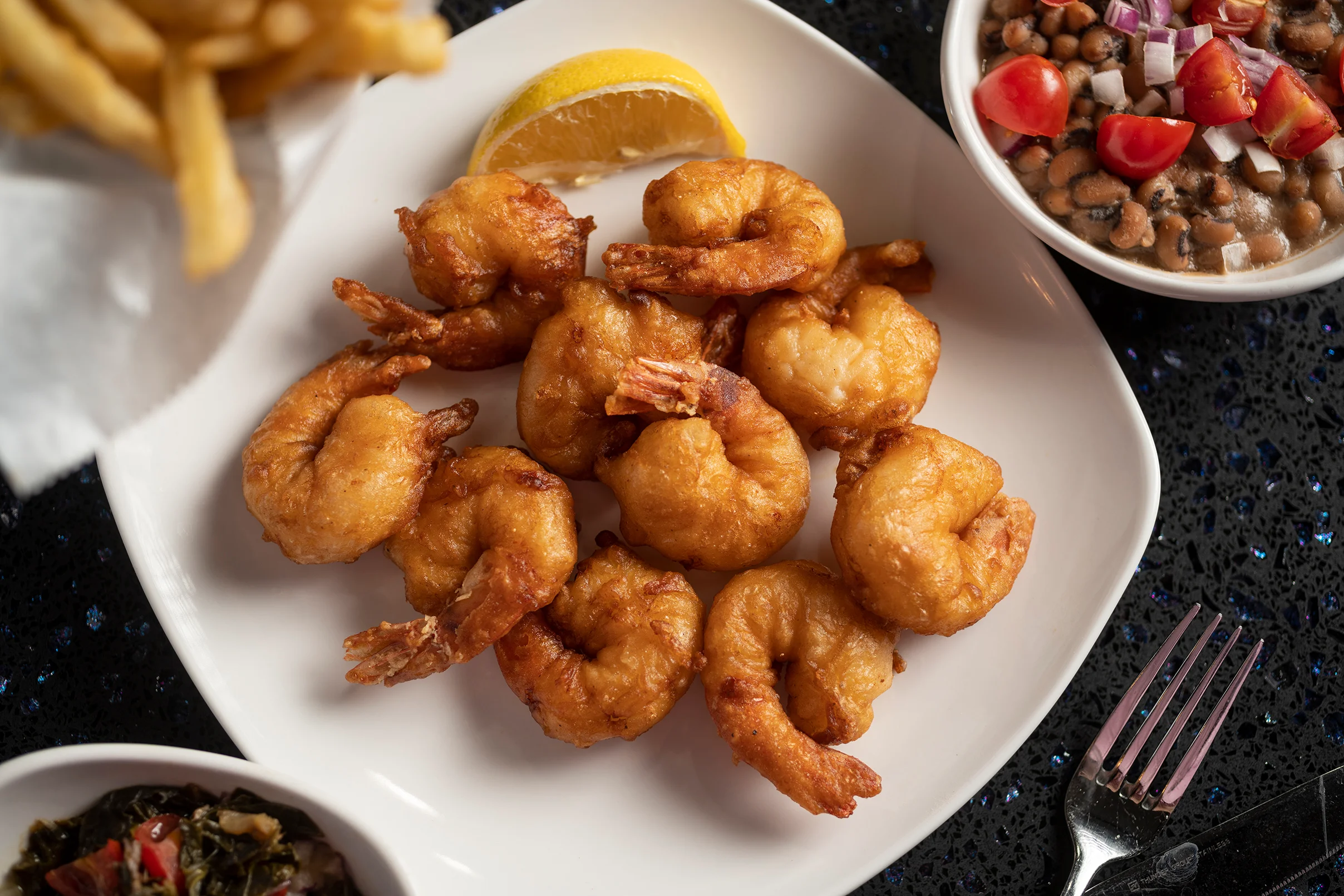 Crispy fried shrimp served with lemon, a classic seafood dish