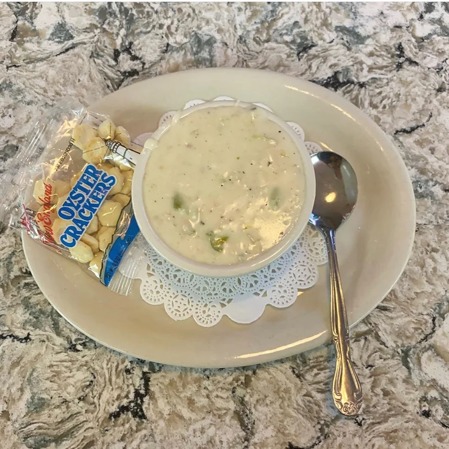 Creamy New England clam chowder with oyster crackers