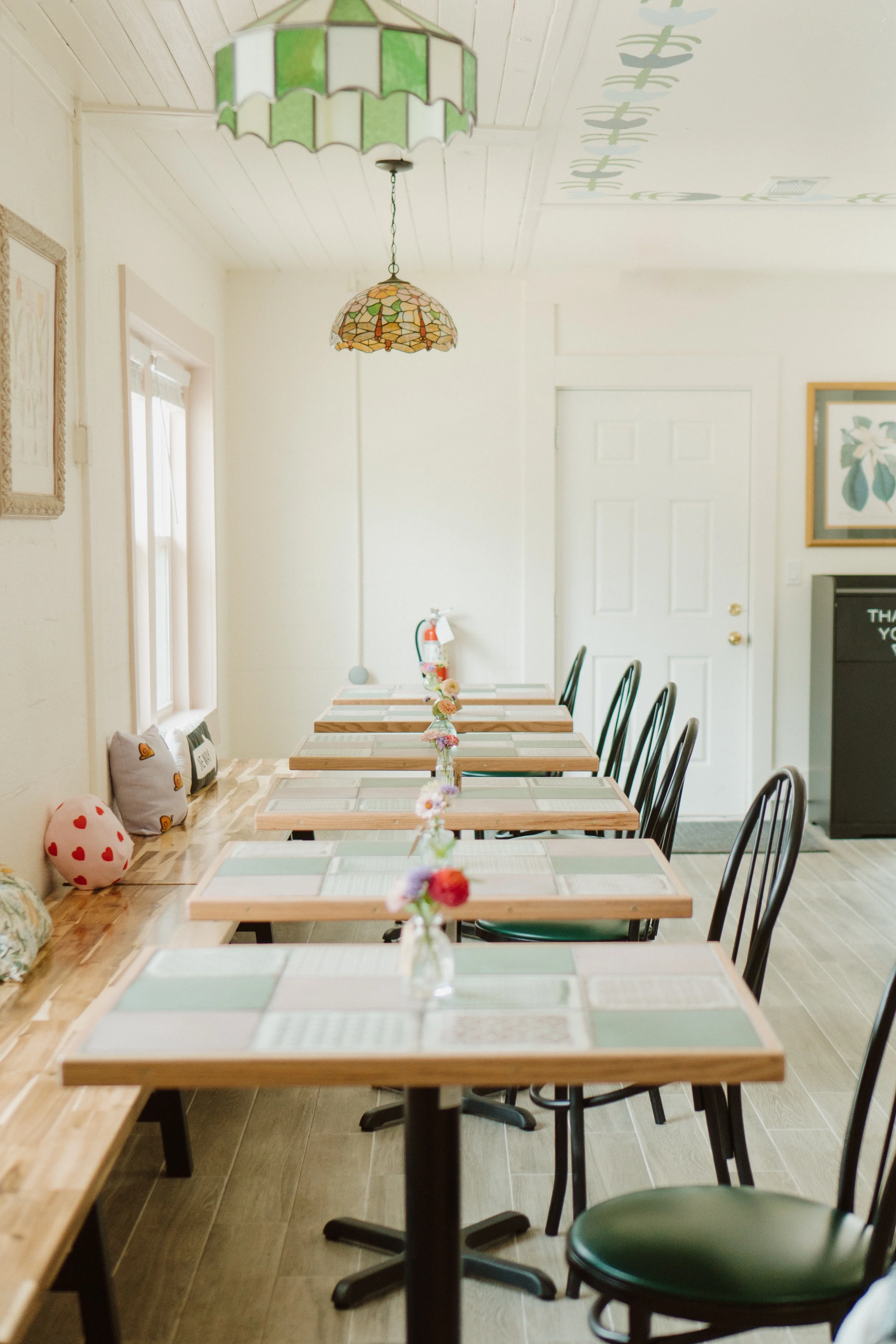 Charming restaurant interior with wooden tables and colorful decor