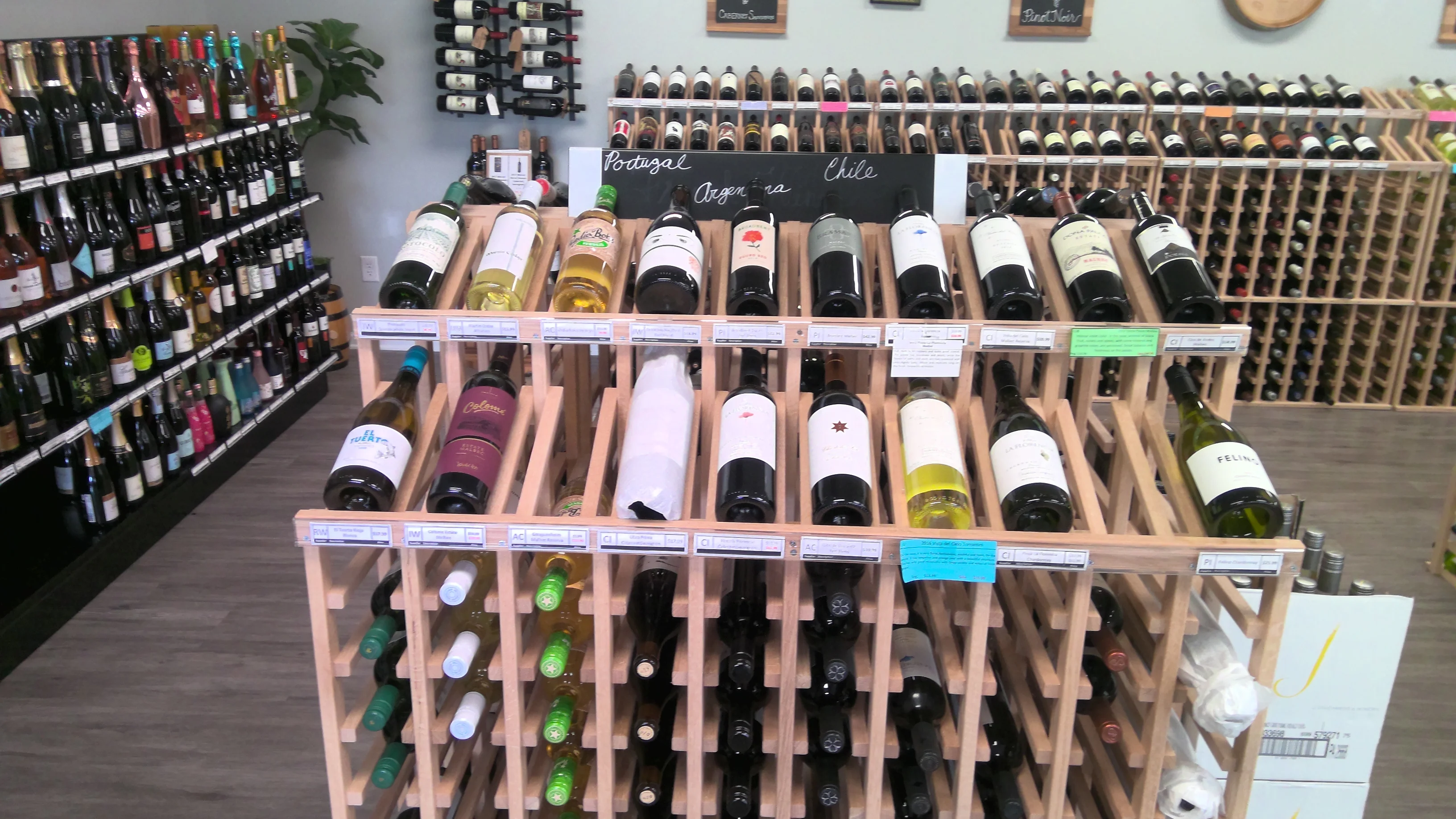 Wine selection display featuring bottles from Portugal, Argentina, and Chile