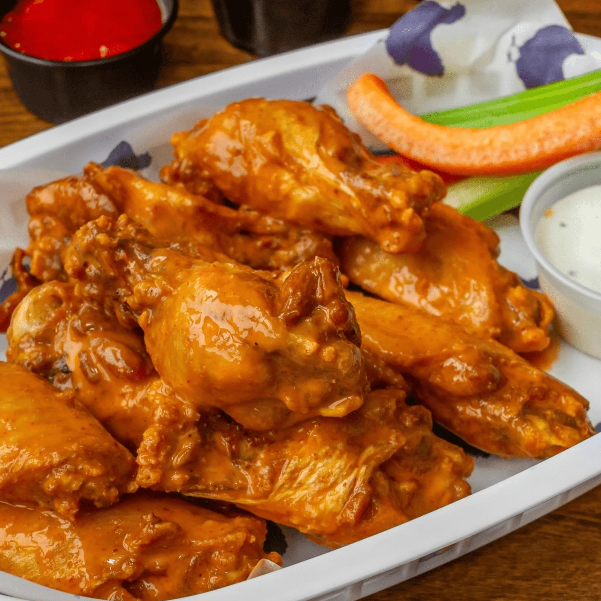 Buffalo chicken wings served with celery and ranch dressing