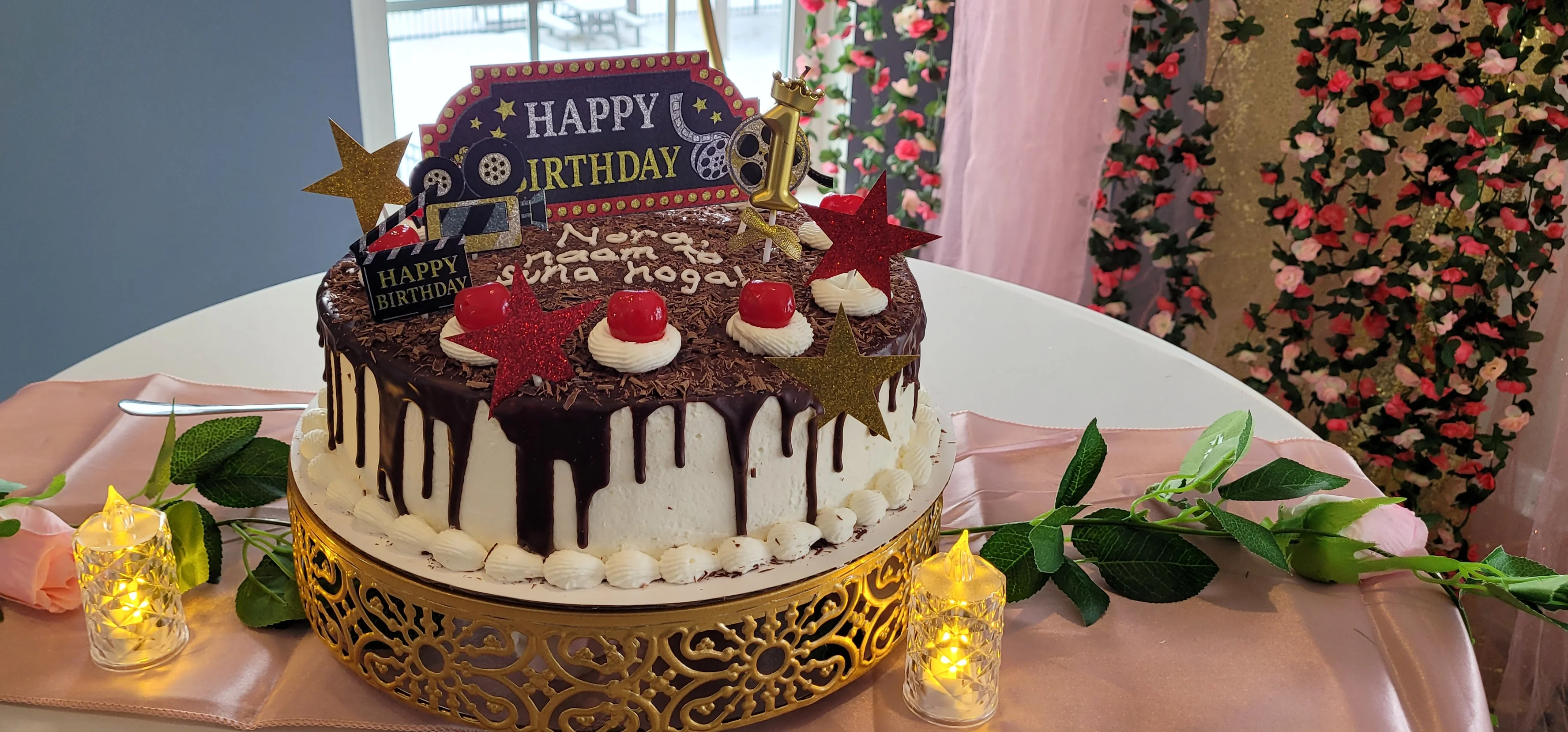 Decorative birthday cake with chocolate and cream frosting