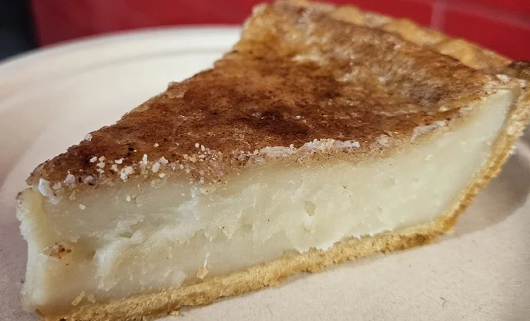 Slice of classic American chess pie on a plate