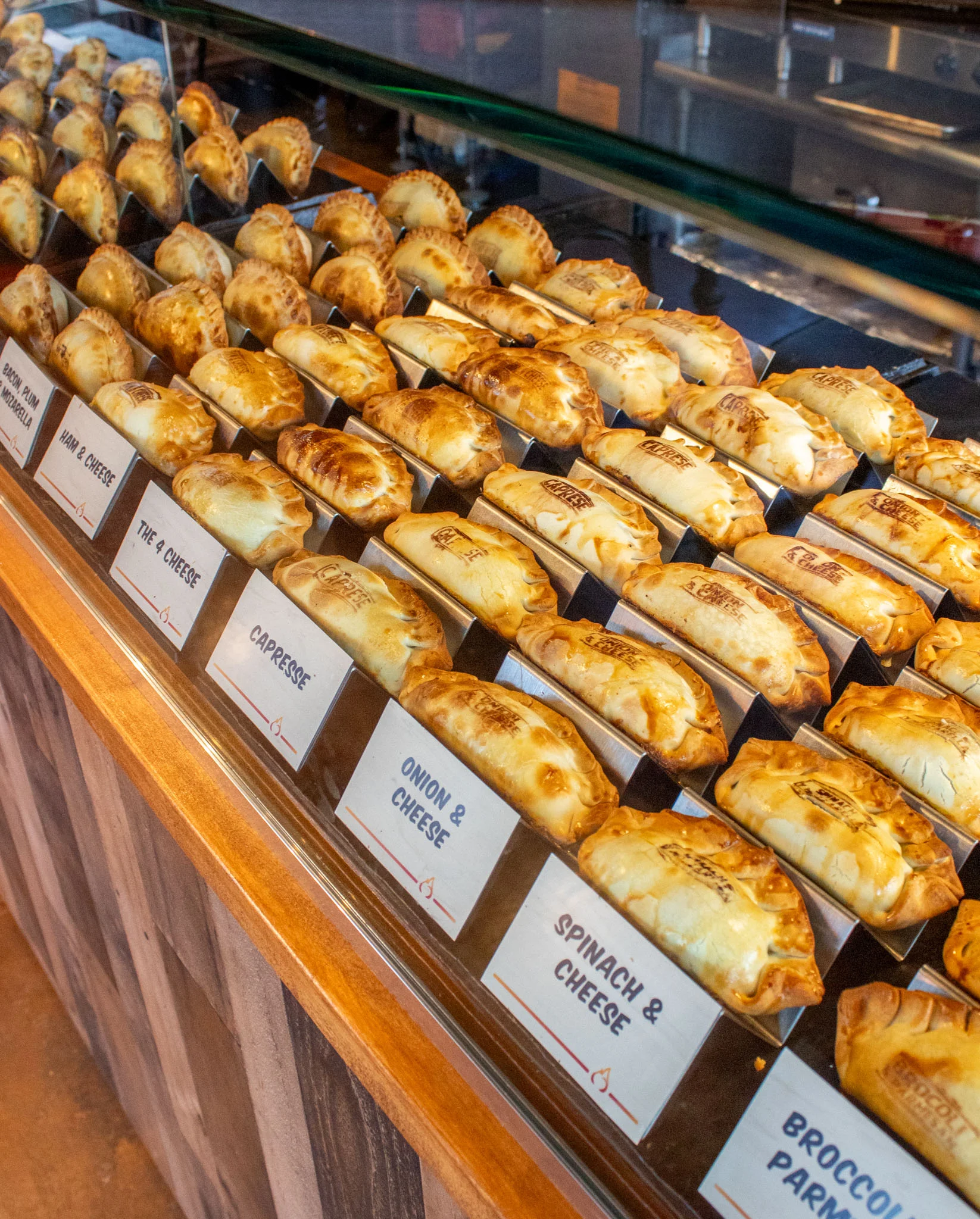Assorted empanadas displayed in a restaurant