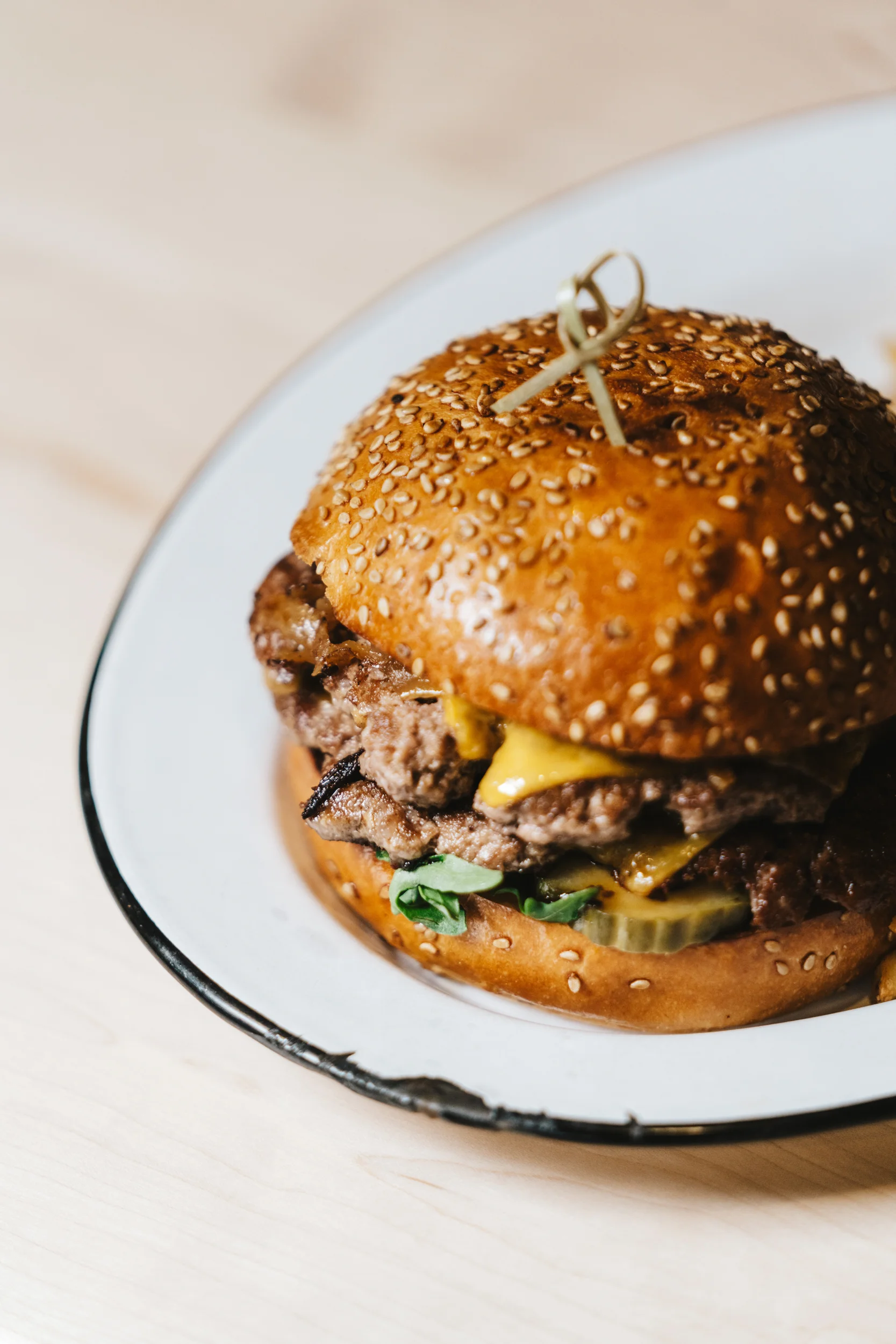 Juicy cheeseburger with sesame seed bun