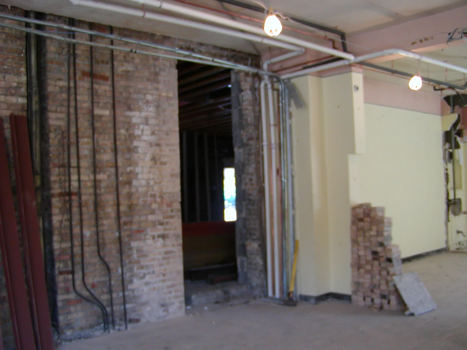 Construction site with exposed brick and electrical wiring