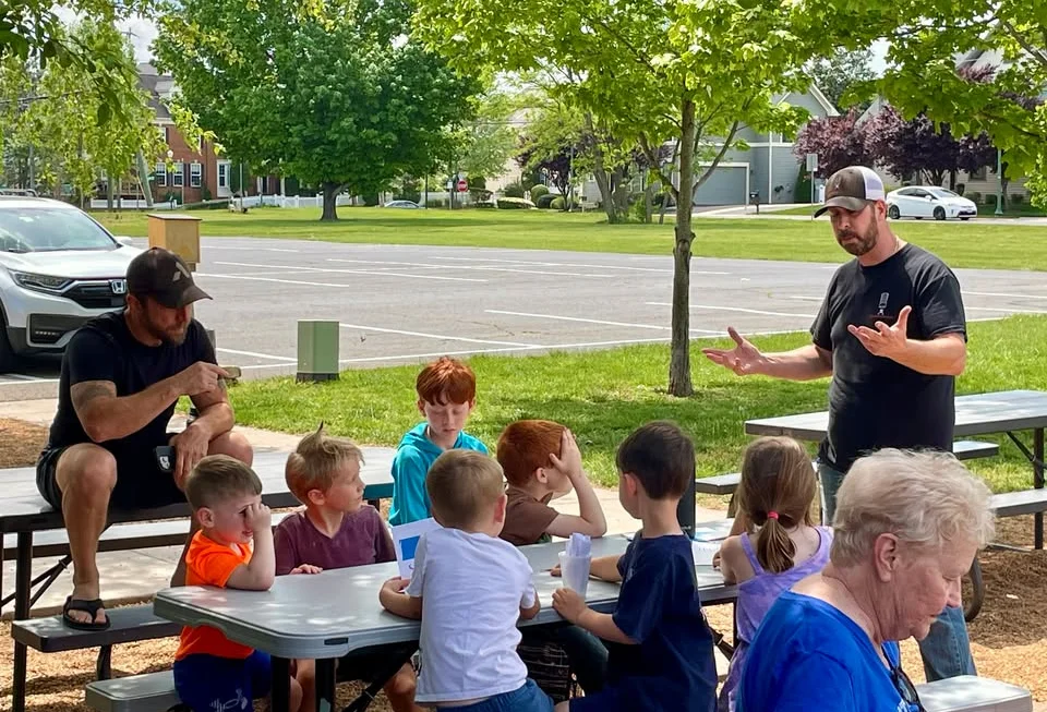 Outdoor gathering of children enjoying a fun activity