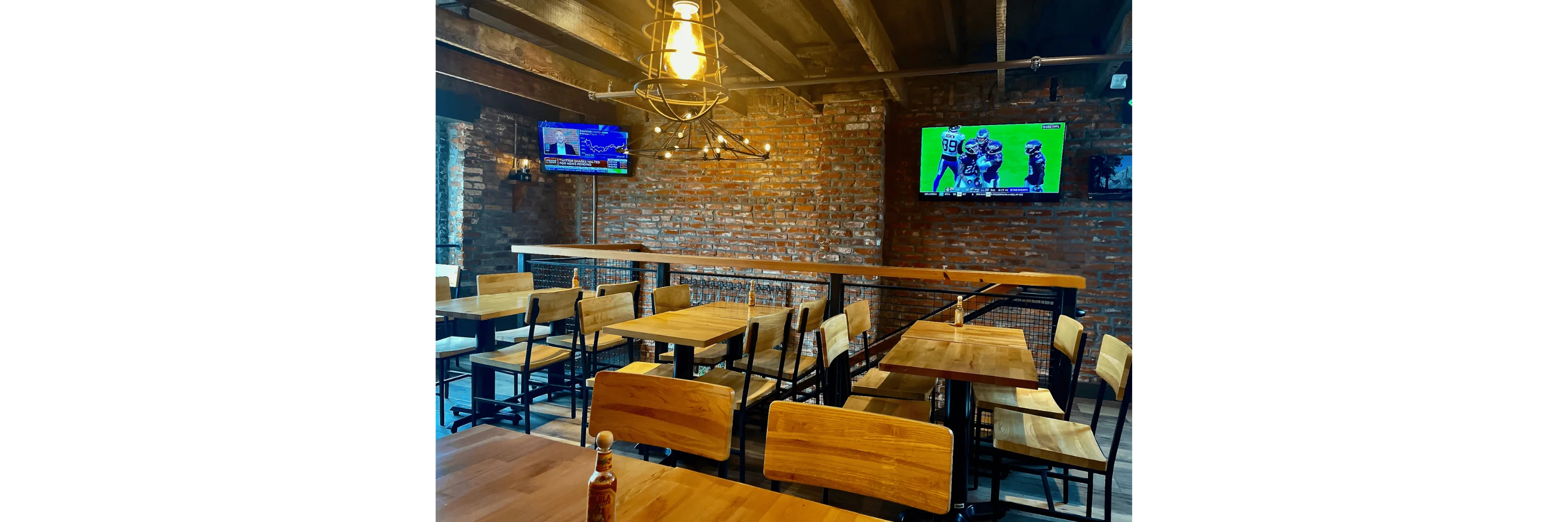 Cozy restaurant interior with exposed brick and modern seating
