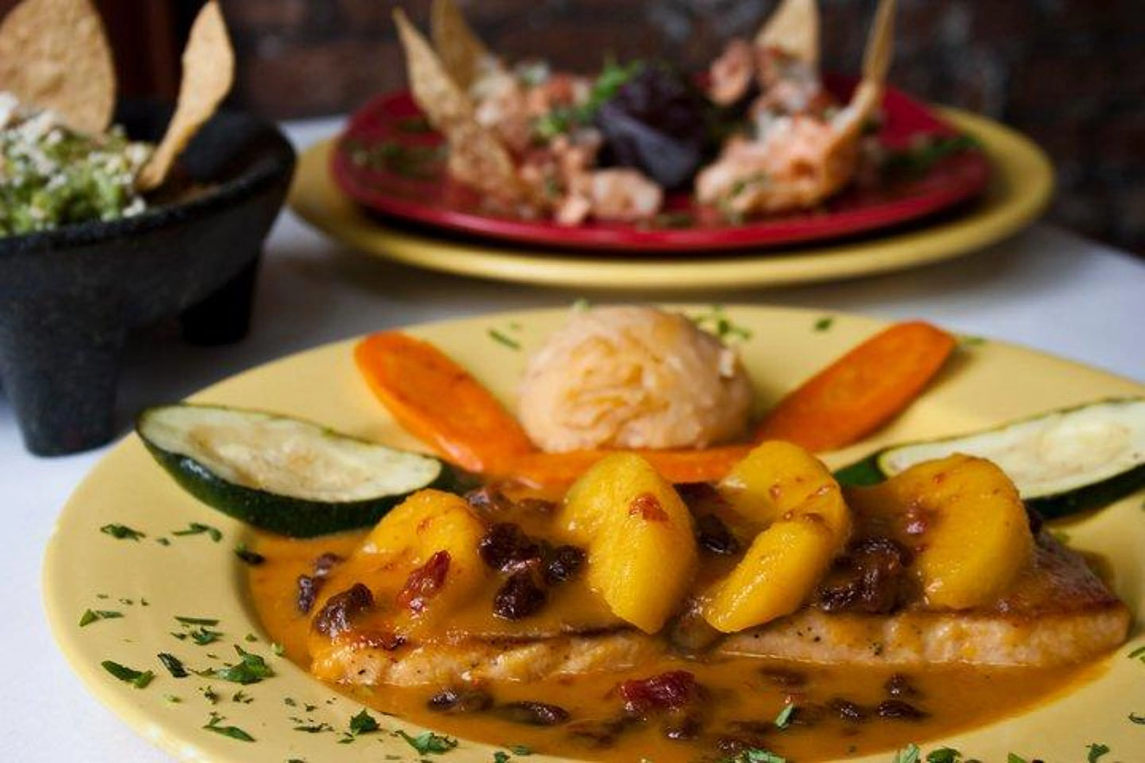 Mexican pescado a la veracruzana with tropical fruit sauce
