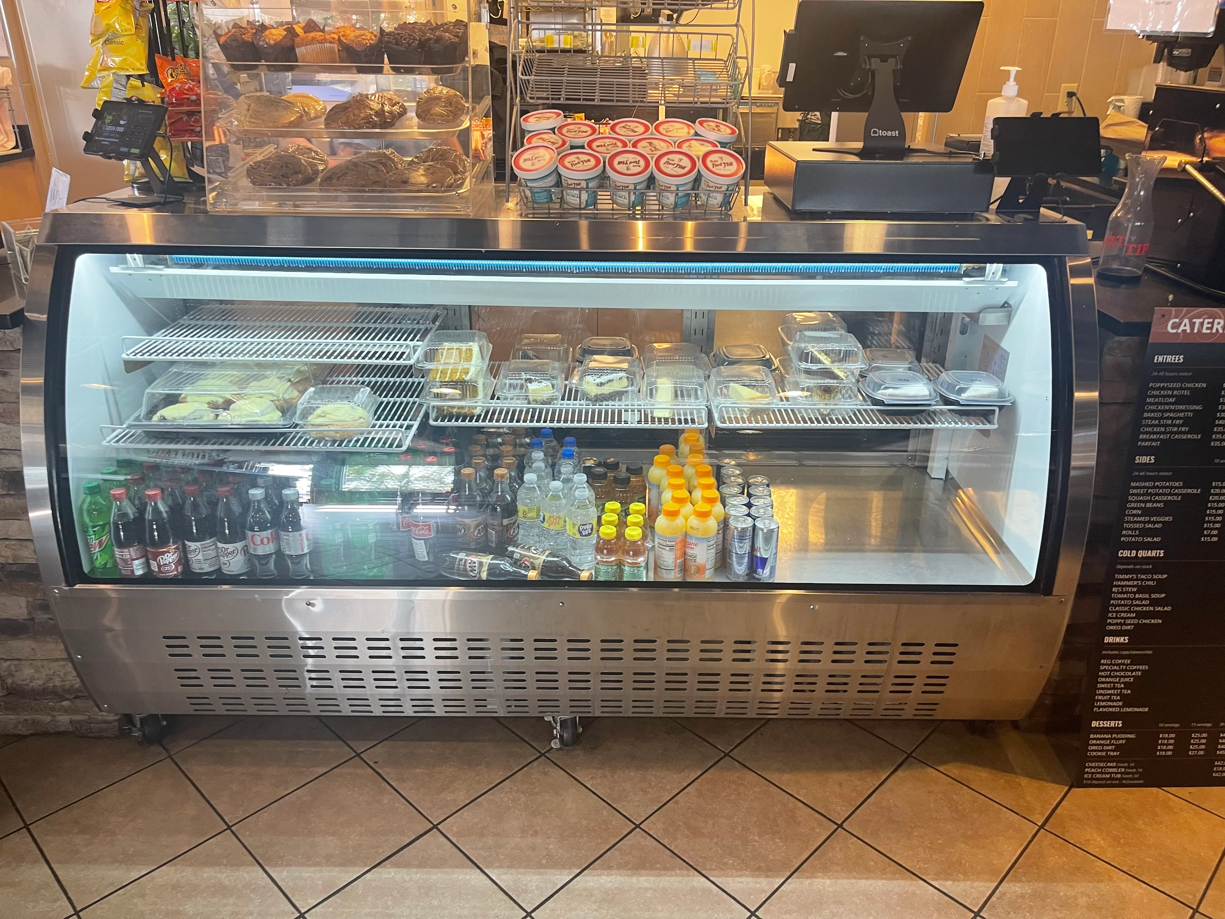 Chilled display case with assorted snacks and beverages