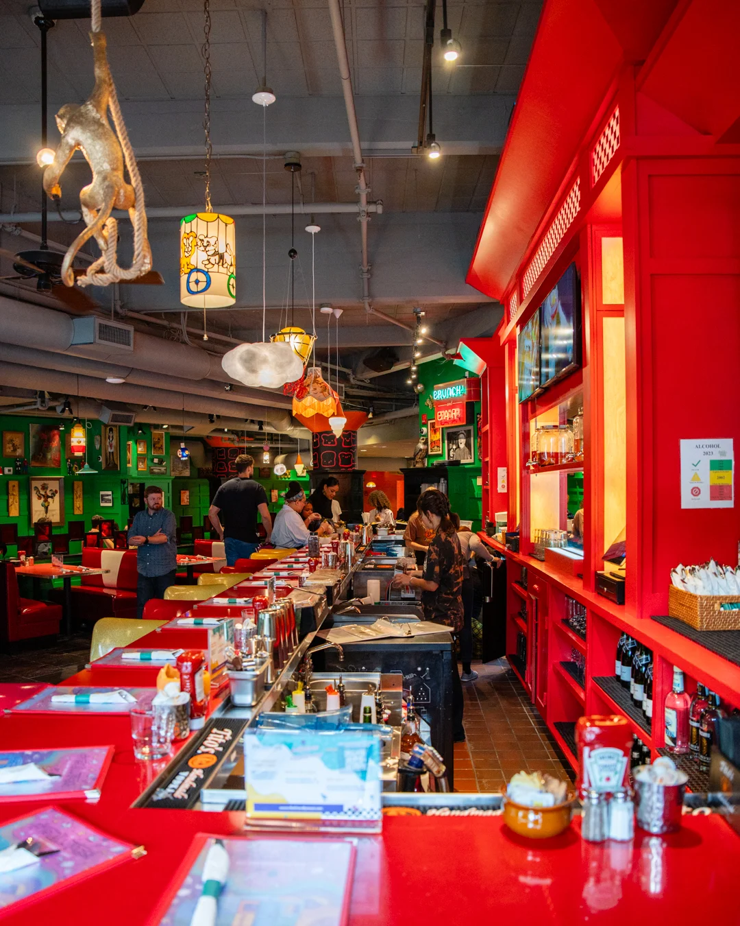 Vibrant restaurant interior with colorful decor and a lively bar area
