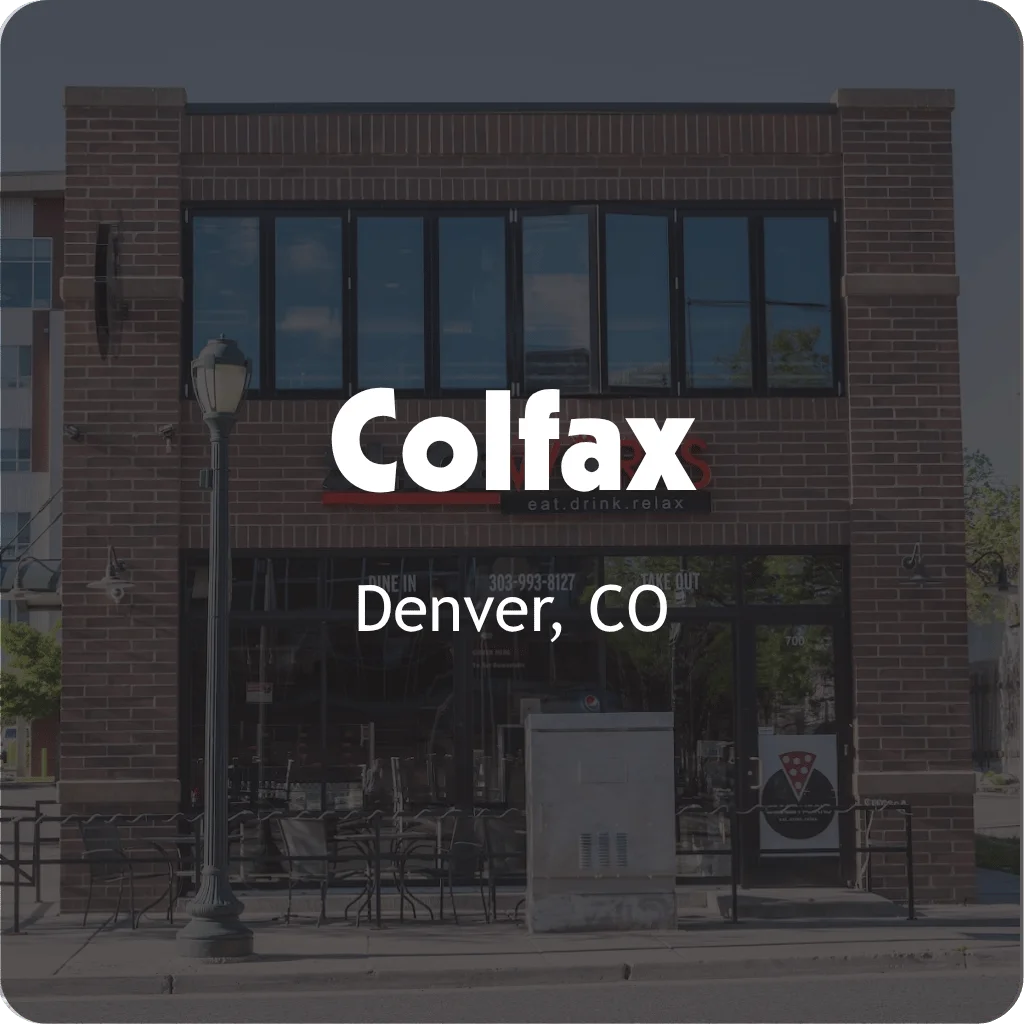 Exterior view of Colfax restaurant with modern design and outdoor seating.