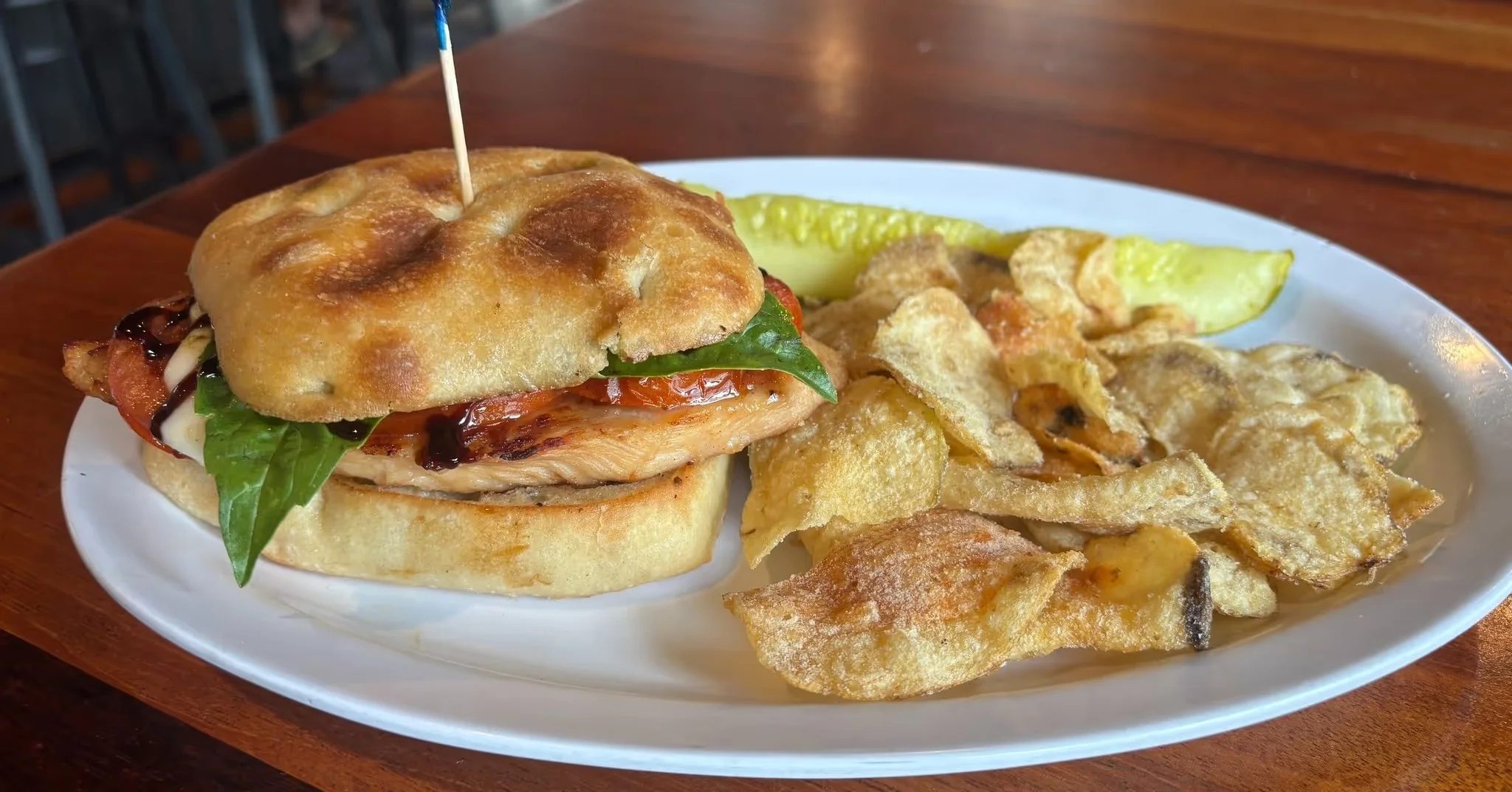 Delicious gourmet burger with fresh toppings on a wooden table