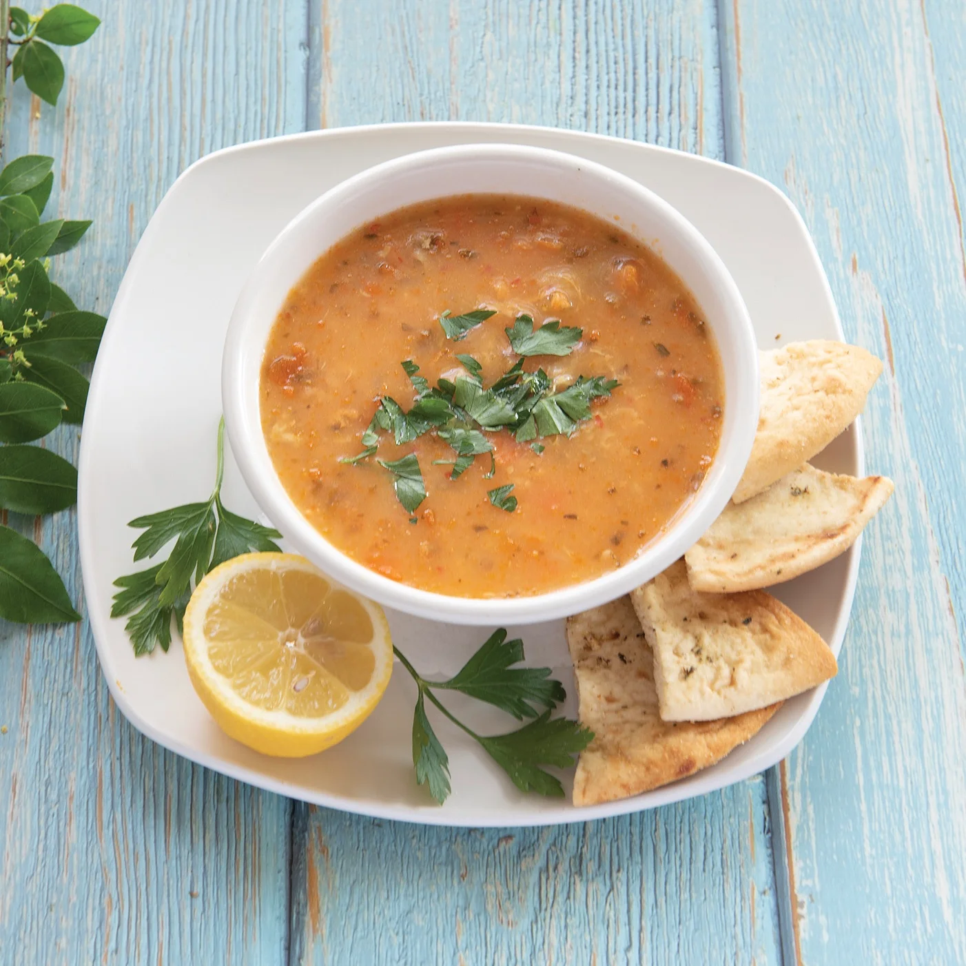 Turkish lentil soup with parsley, lemon, and toasted flatbread