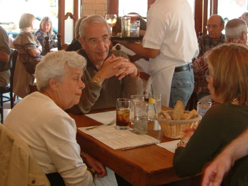 Cozy restaurant scene with diners engaged in conversation