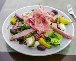 Italian antipasto salad with cured meats and olives