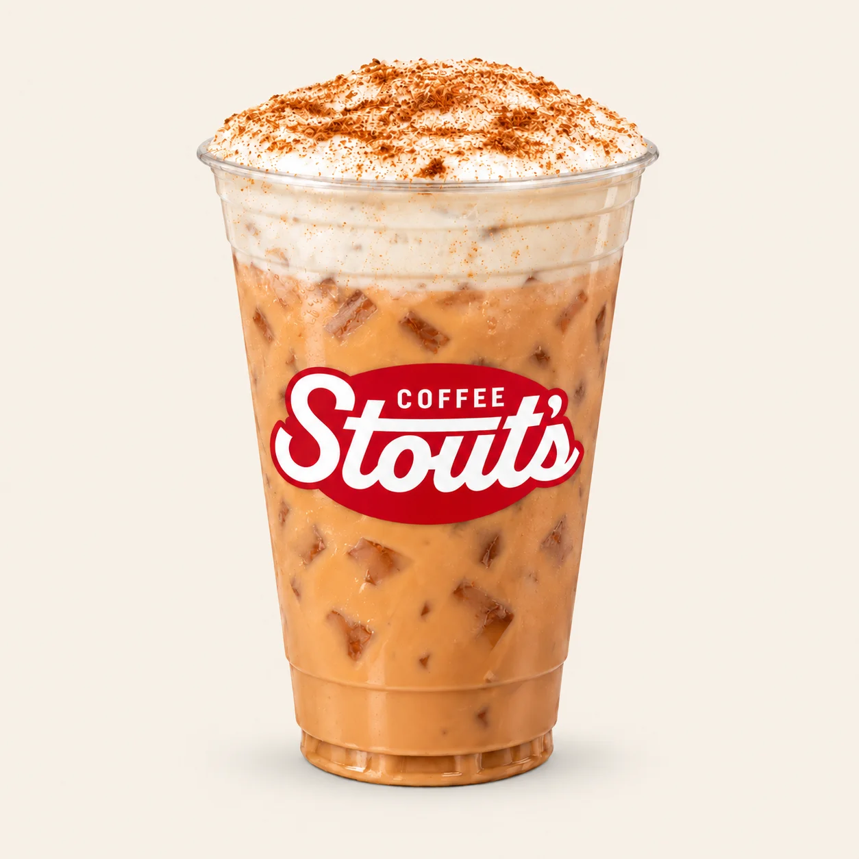 Iced chai topped with cinnamon cold foam in a Stout’s Coffee cup.