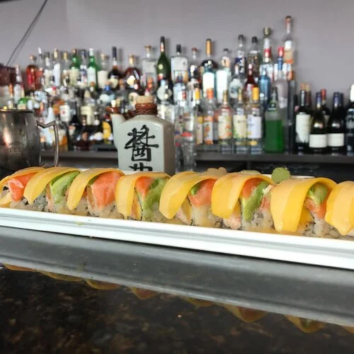 Colorful sushi rolls with fresh fish and avocado